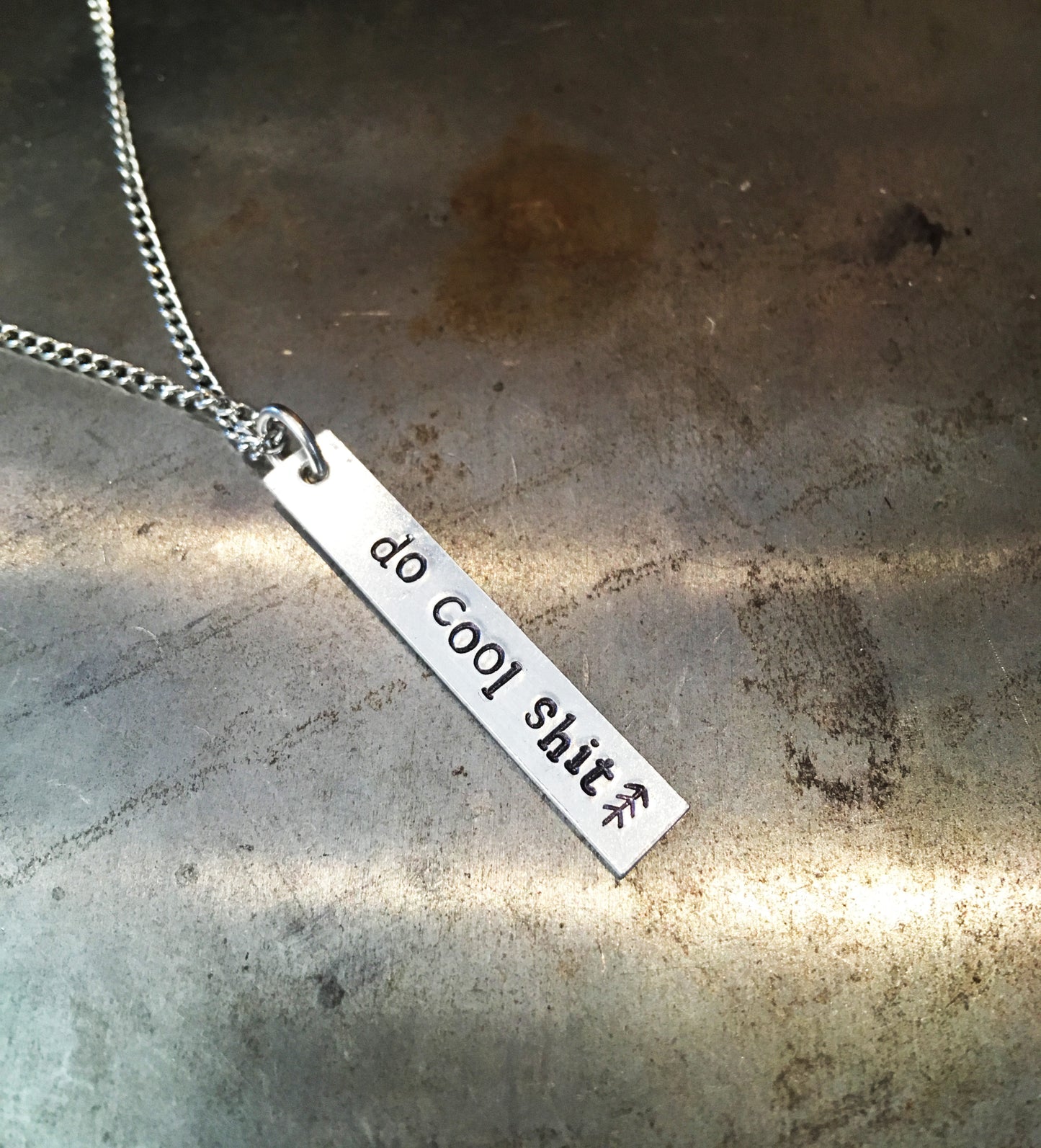 "Do Cool Shit" handmade aluminum bar necklace